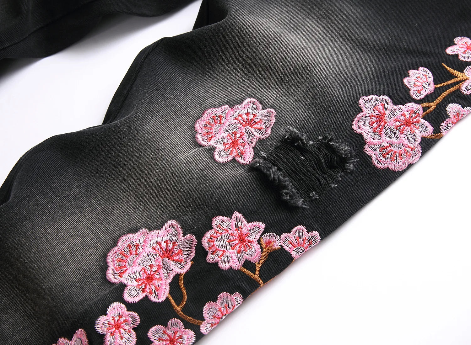 Men's high-street ripped jeans with floral embroidery patchwork, trendy street-style distressed flared jeans